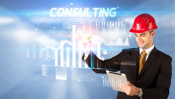 Young businessman with helmet drawing on virutal screen — Stock Photo, Image