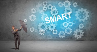 Şemsiye konseptiyle savunma yapan iş adamı