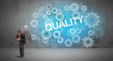 Şemsiye konseptiyle savunma yapan iş adamı