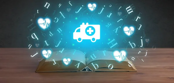 Open medical book with health icons above