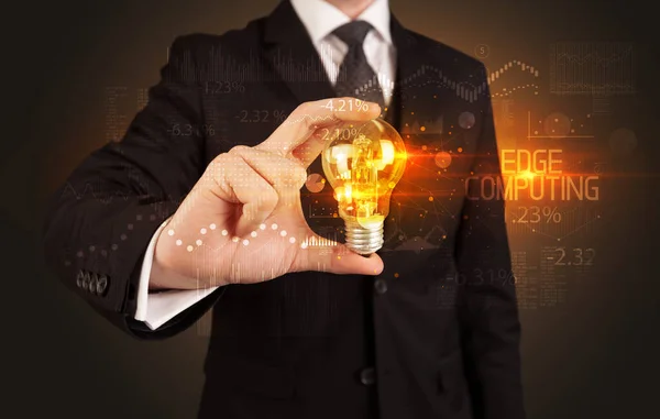 Businessman holding a lightbulb concept — Stock fotografie