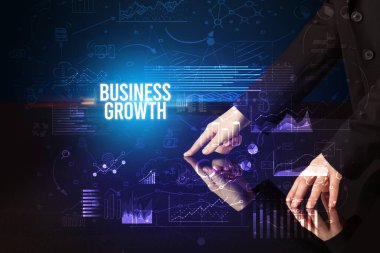 Businessman touching huge screen concept