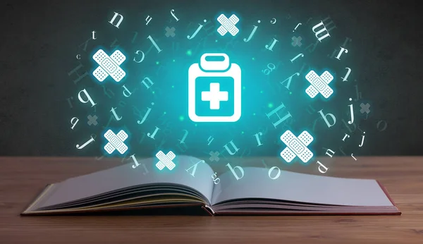 Open medical book with health icons above