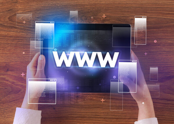 Close-up of a hand holding tablet