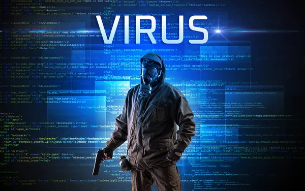 Faceless hacker at work with ROOTKIT VIRUS inscription, Computer