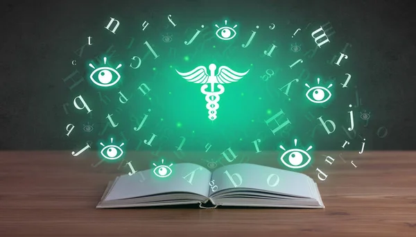 Open medical book with health icons above — Stock Photo, Image