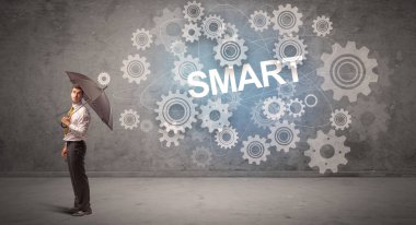 Şemsiye konseptiyle savunma yapan iş adamı