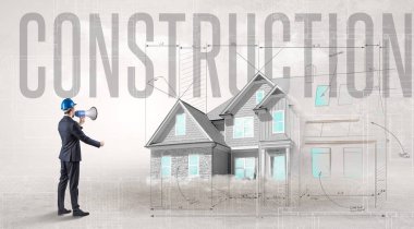 Planı elinde tutan genç mühendis.