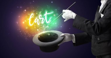 Genç sihirbaz sihir numarası yapıyor.