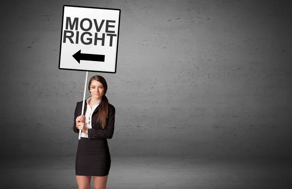 Business person holding a traffic sign — Stock Photo, Image