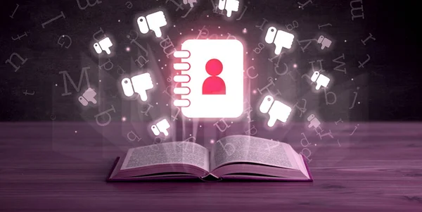 Open book with social networking icons above — Stock Photo, Image