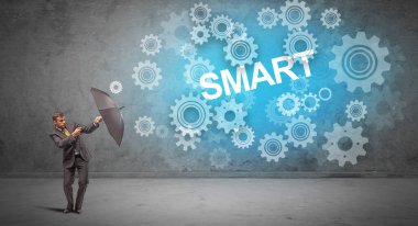 Şemsiye konseptiyle savunma yapan iş adamı