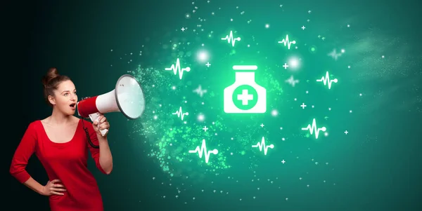 Young person with megaphone and healthcare icon — Stock Photo, Image