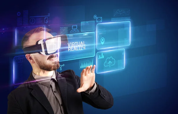 Businessman looking through Virtual Reality glasses, tech concept — Stock Photo, Image