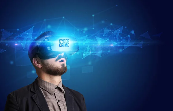 Businessman looking through Virtual Reality glasses, virtual security concept — Stock Photo, Image