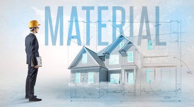 Genç mühendis proje konseptini elinde tutuyor