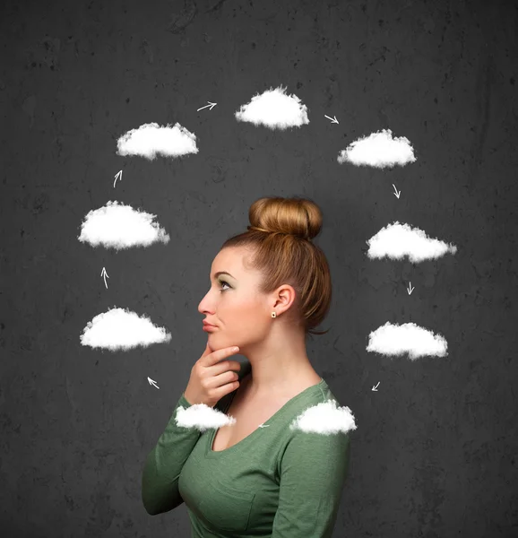 Young woman thinking with cloud circulation around her head — Stock Photo, Image