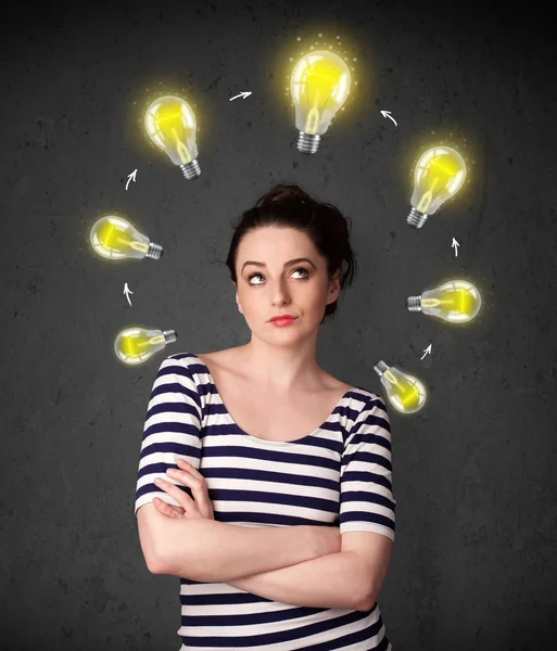 Young woman thinking with lightbulb circulation around her head — Stock Photo, Image