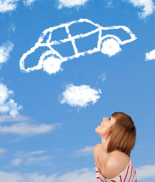 Young girl looking at car cloud on a blue sky — Stock Photo, Image