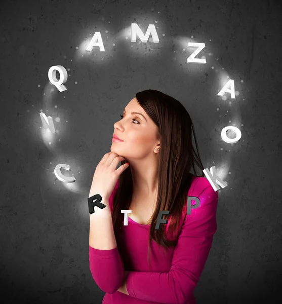 Young woman thinking with letter circulation around her head — Stock Photo, Image