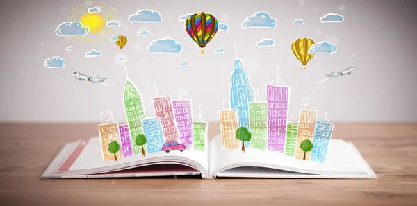 Cityscape drawing on open book — Stock Photo, Image