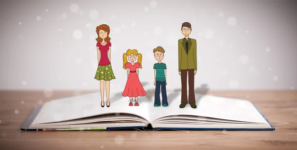 Рисунок счастливой семьи на открытой книге — стоковое фото