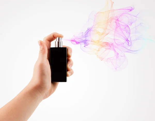 Woman hands spraying perfume — Stock Photo, Image