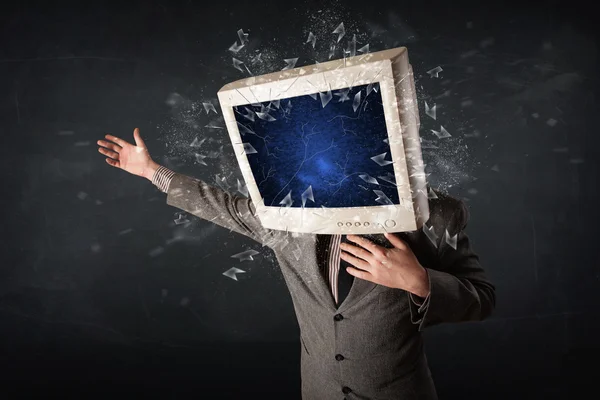 Computer monitor screen exploding on a young persons head — Stock Photo, Image