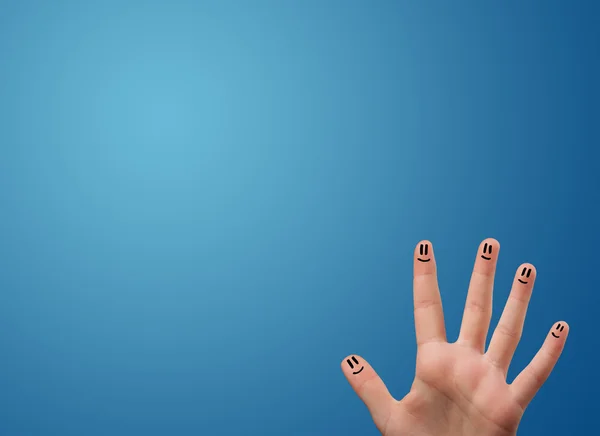 Glücklich Smiley Gesicht Finger Blick auf leere blaue Hintergrundkopie — Stockfoto