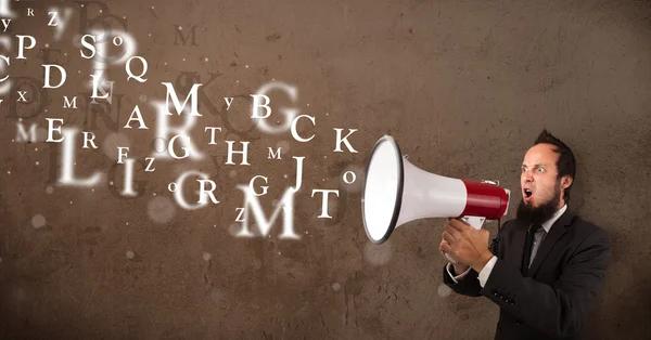 Man in shirt shouting into megaphone and text come out — Stock Photo, Image