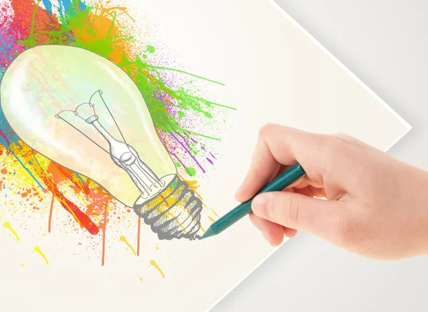 Hand drawing on paper a colorful splatter lightbulb — Stock Photo, Image