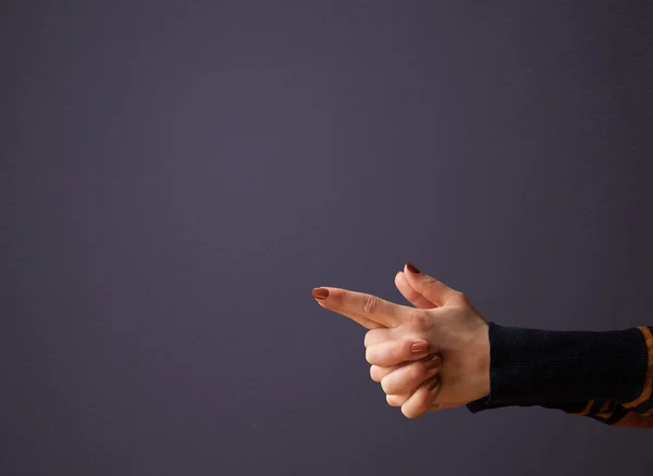 Gun shaped woman hand — Stock Photo, Image