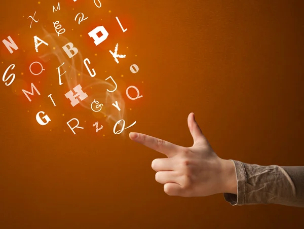 Letters coming out of gun shaped hands — Stock Photo, Image