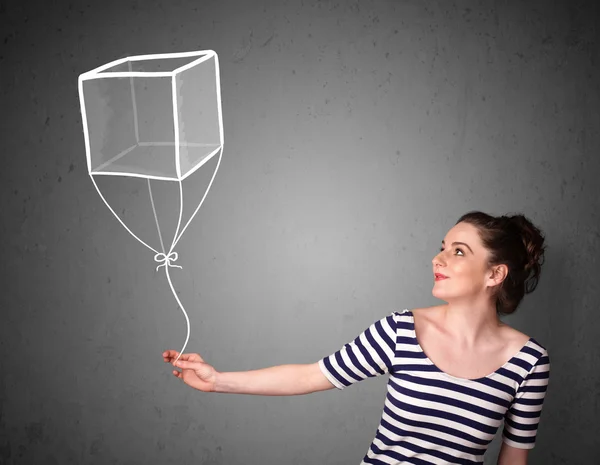 Vrouw met een kubus ballon — Stockfoto