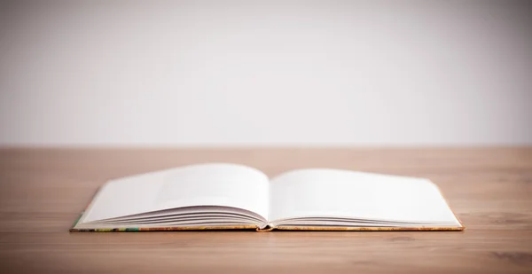 Open book on wooden deck — Stock Photo, Image