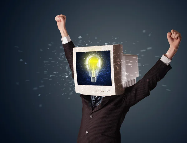 Business man with a pc monitor head and idea light bulb in the d — Stock Photo, Image