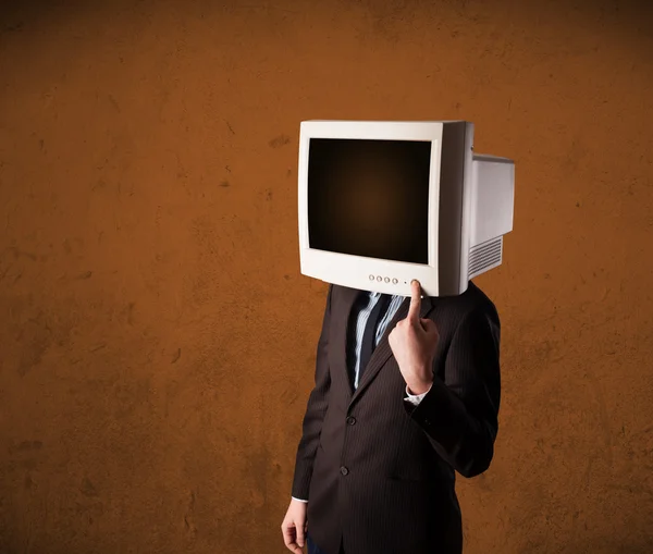 Homem de negócios com um monitor na cabeça e espaço vazio castanho — Fotografia de Stock