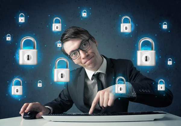 Young hacker with virtual lock symbols and icons — Stock Photo, Image