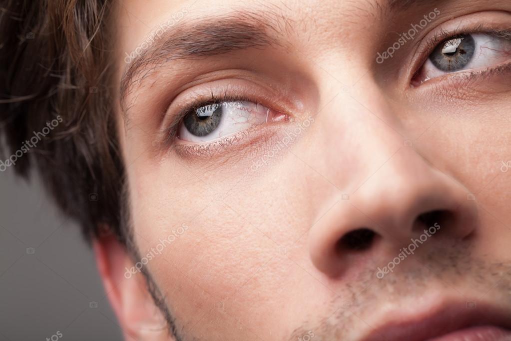 Portrait of a handsome man close up eye Stock Photo by ©ra2studio 52503625