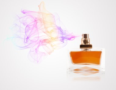 Perfume bottle spraying colored scent clipart