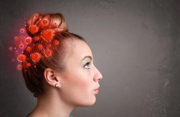 Young person thinking about love with red hearts — Stock Photo, Image