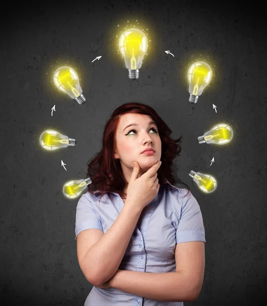 Young woman thinking with lightbulb circulation around her head — Stock Photo, Image