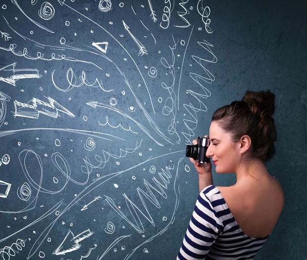 Photographer shooting images while energetic hand drawn lines an — Stock Photo, Image