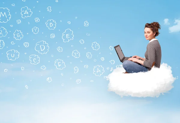 Young woman sitting in cloud with laptop — Stock Photo, Image