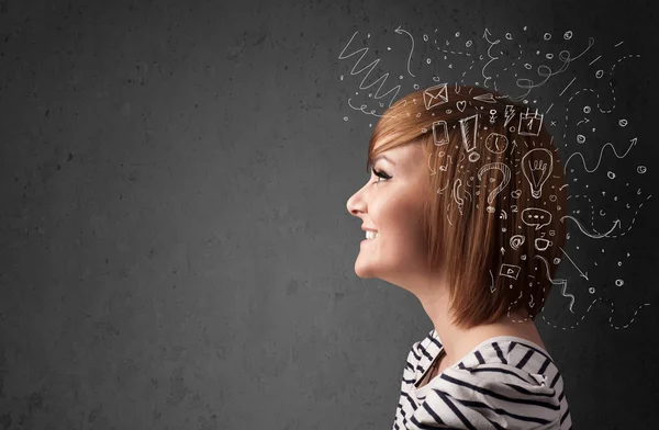 Young girl thinking with abstract icons on her head — Stock Photo, Image