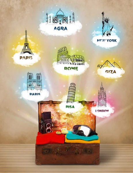 Tourist suitcase with famous landmarks around the world — Stock Photo, Image