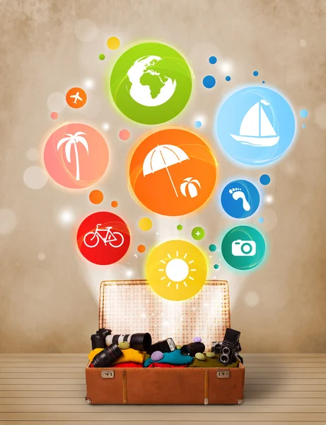 Suitcase with colorful summer icons and symbols — Stock Photo, Image