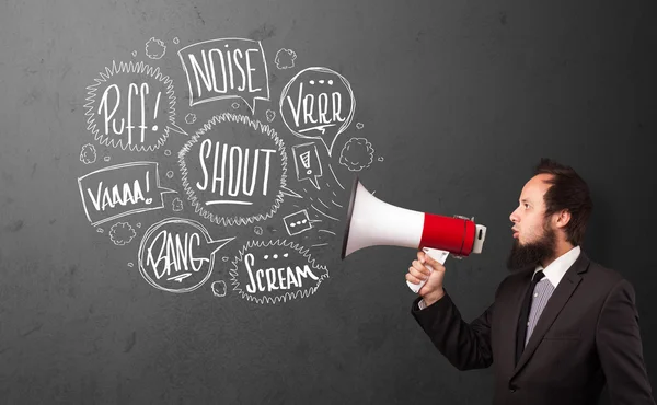 Guy in suit yelling into megaphone and hand drawn speech bubbles — Stock Photo, Image