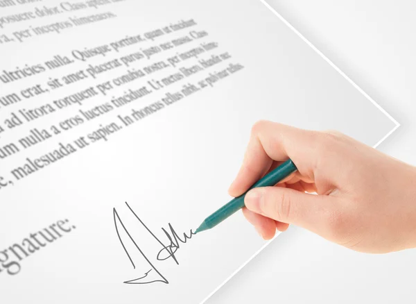 Hand writing personal signature on a paper form — Stock Photo, Image