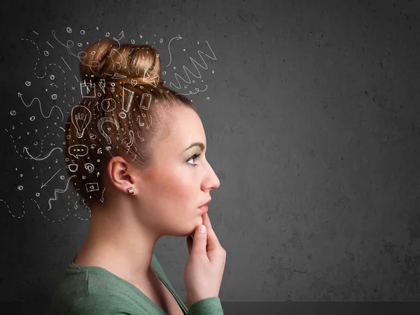 Young girl thinking with abstract icons on her head — Stock Photo, Image